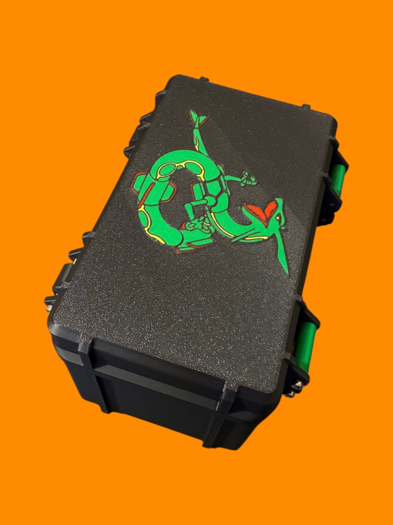 Black rugged deck box with lime-green latches and a Rayquaza dragon graphic on the lid